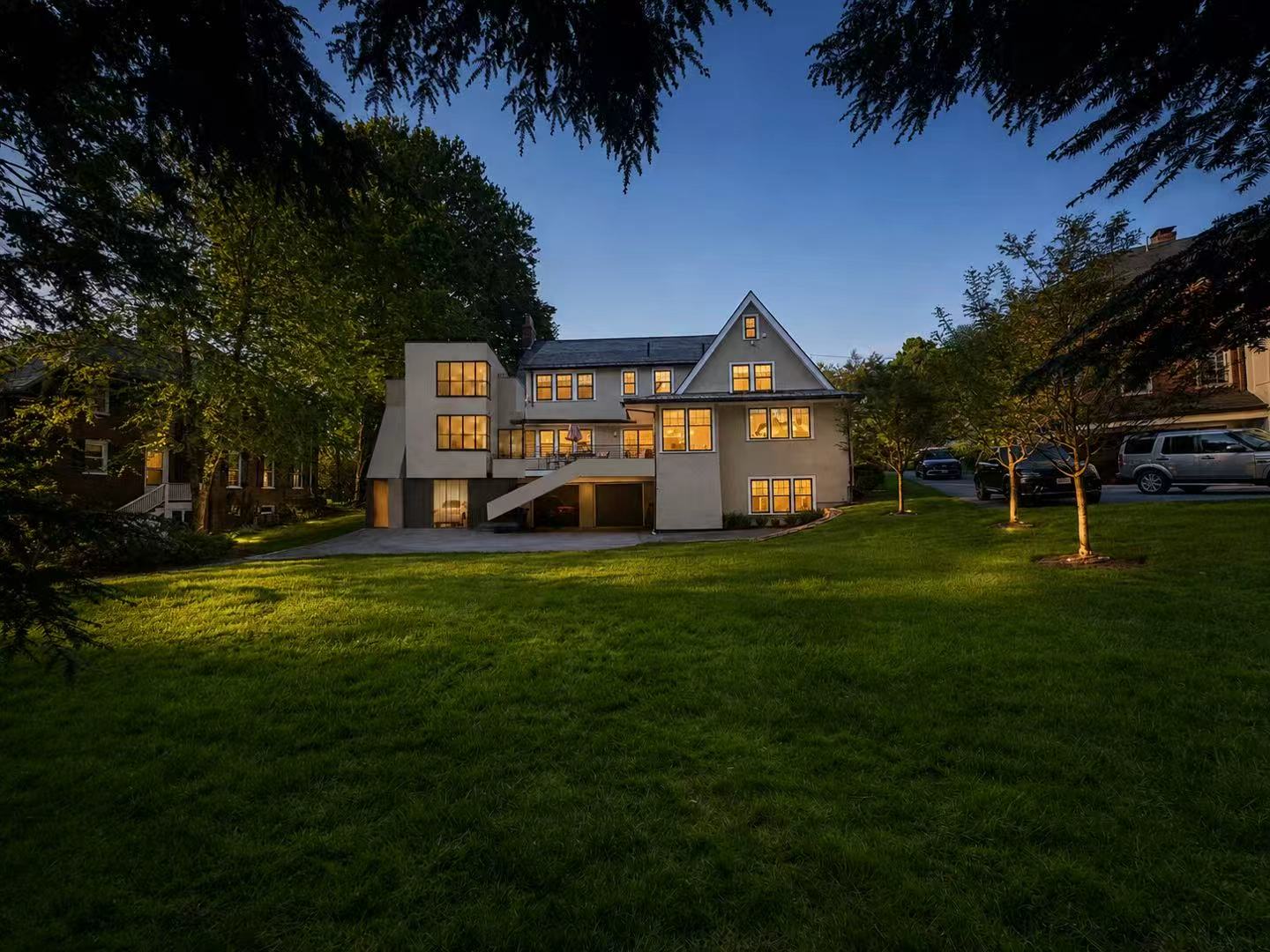 Garden elevation · house and extension at dusk